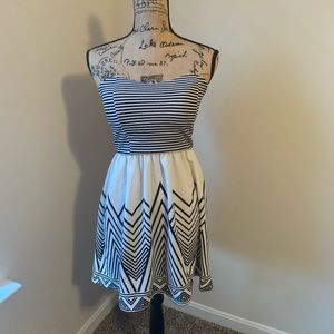 Black and white strapless mini dress